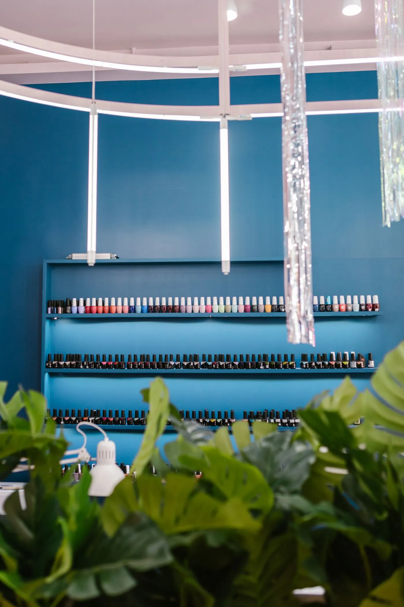 Wall lined with rows of nail polish